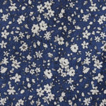 Tissu motif petites fleurs blanches sur fond bleu